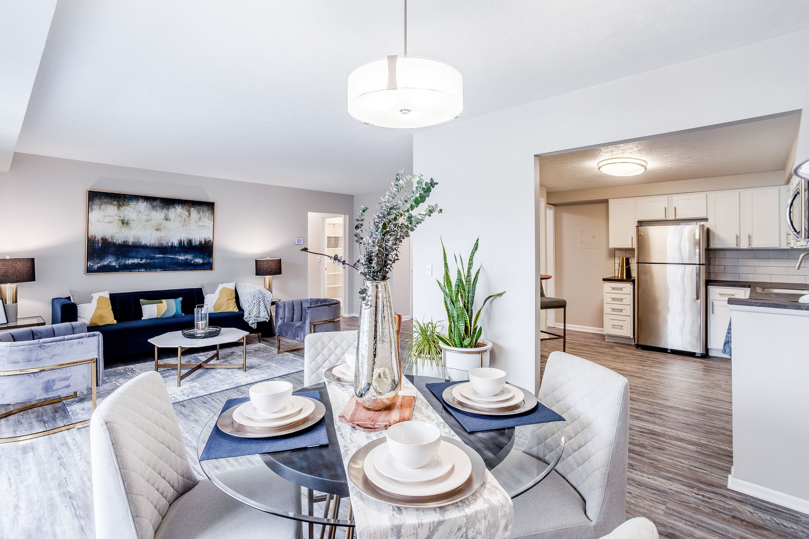 Interior of a Vantage apartment’s open floor plan with a dining area, living room, and kitchen 